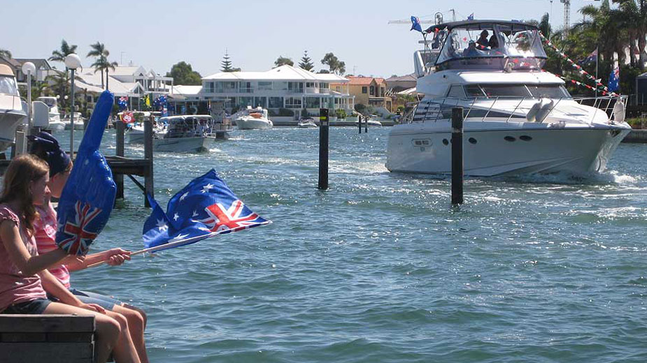 Flotilla of boats parade past our Mandurah jetty for Australia Day