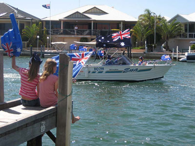 Waving at Mandurah's Australia Day flotilla from Port Sails Canal Villa jetty